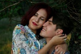 happy romantic couple in forest