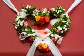 a wreath of flowers in the shape of a heart