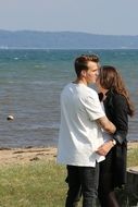 romantic date of a couple in love on the lake