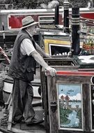 happy old man in painted boat