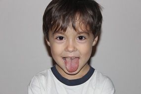 boy sticking out tongue