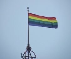 rainbow flag at sky, symbol of lesbian, gay, bisexual, transgender, and queer pride