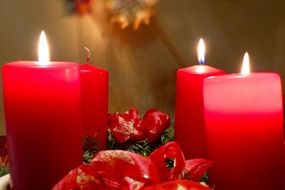 red candles in a christmas wreath