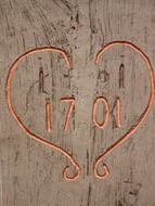 heart with a number on a wooden board