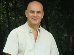 portrait of a smiling bold man