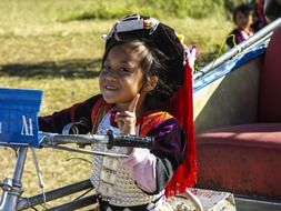 young thai girl on bike