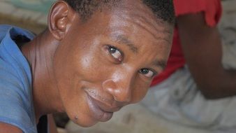 smiling african man looking up