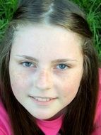 Little girl with freckles and long black hair