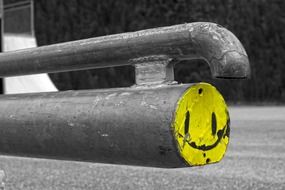 yellow smiley on a black and white picture