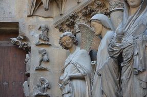 statues of angels near the wall in the cathedral