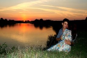 couple in love near the water in the evening