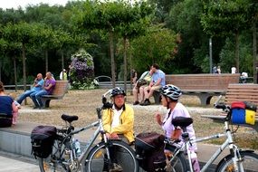 people relaxing in the city park