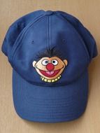 blue cap with smiling cartoon face