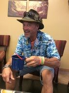 Happy smiling and sitting man