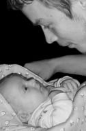 Black and white photo of the baby and father