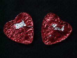 packed red heart, which is divided in half on a black background