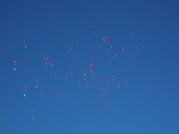 Sky with red balloons