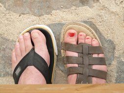 sandals and flip-flops on her feet