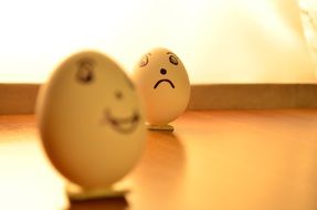 Eggs on a stand with funny faces