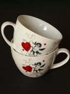 white cups with a picture of the heart