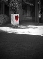 Black and white photo with the red heart