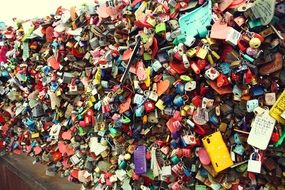 locks hang on the wall of the tower namsan