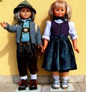 smiling boy and girl dolls