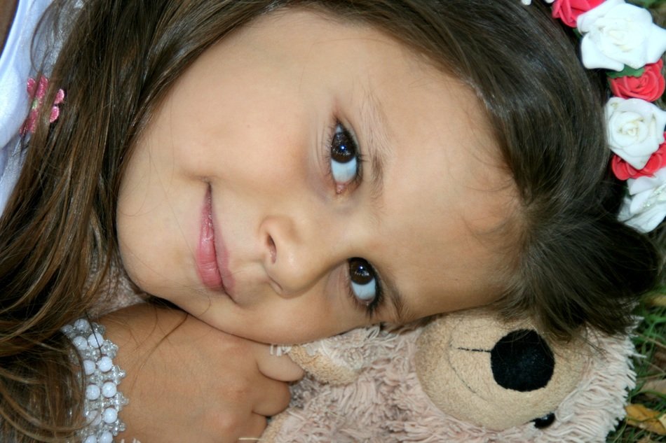 portrait of a girl with a teddy bear in his hands