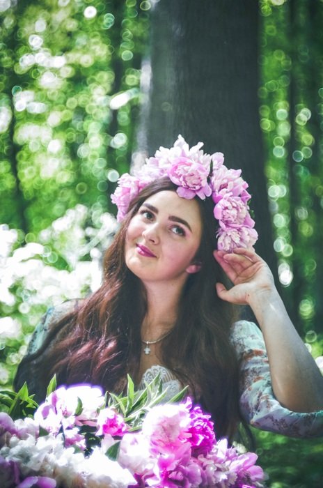 Girl with white and purple flowers on the head
