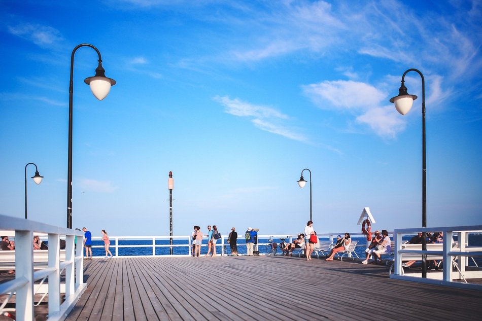 people on a pier in summer