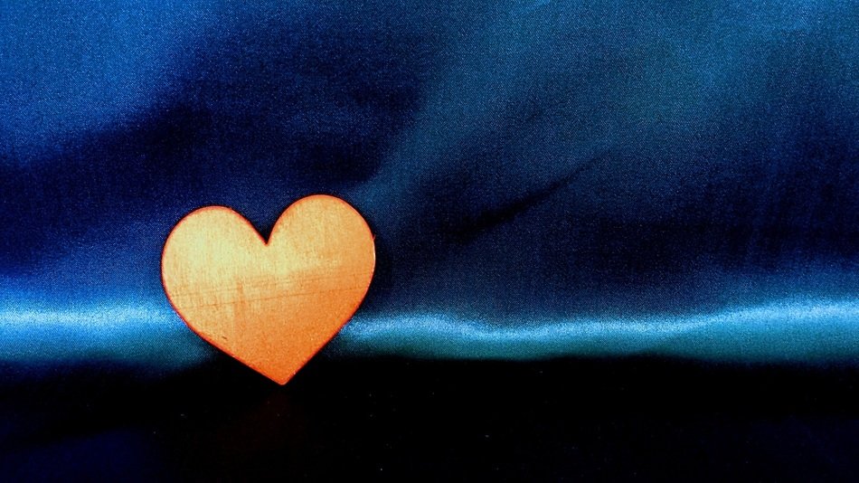 yellow heart on blue background