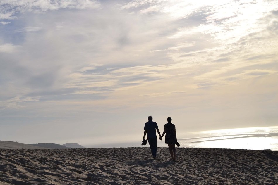 romantic couple walking on the beach