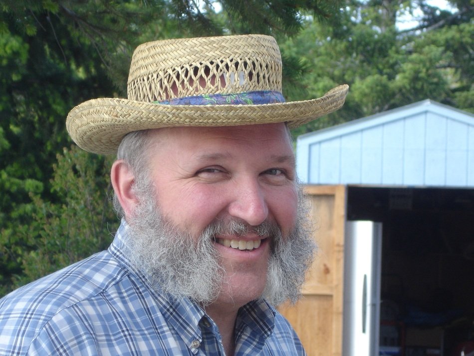 Happy man with grey fuzzy beard