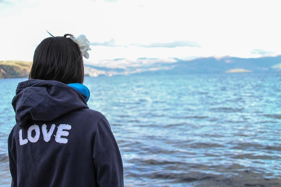 woman with the word 'love' on her back