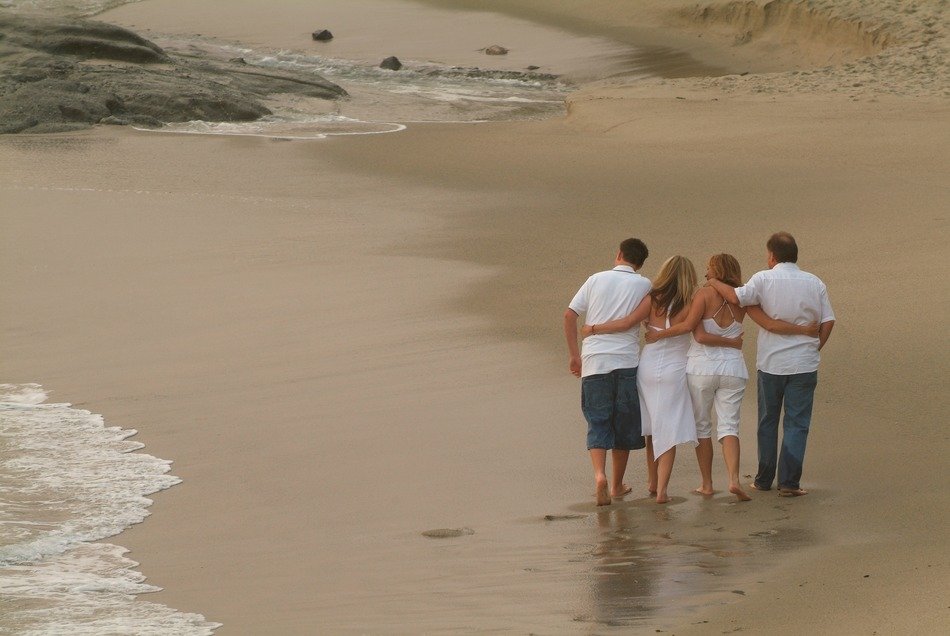 family walking beach