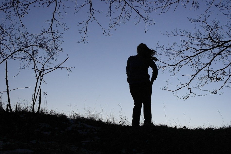 Landscape of lonely girl in a forest