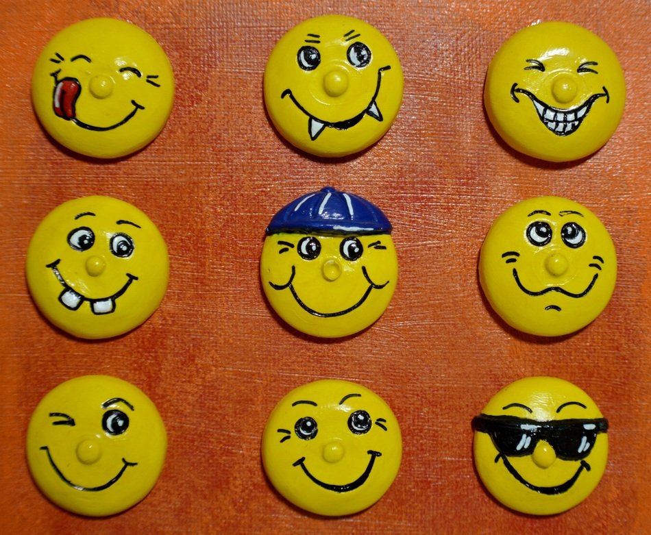 yellow smileys face on a brown surface