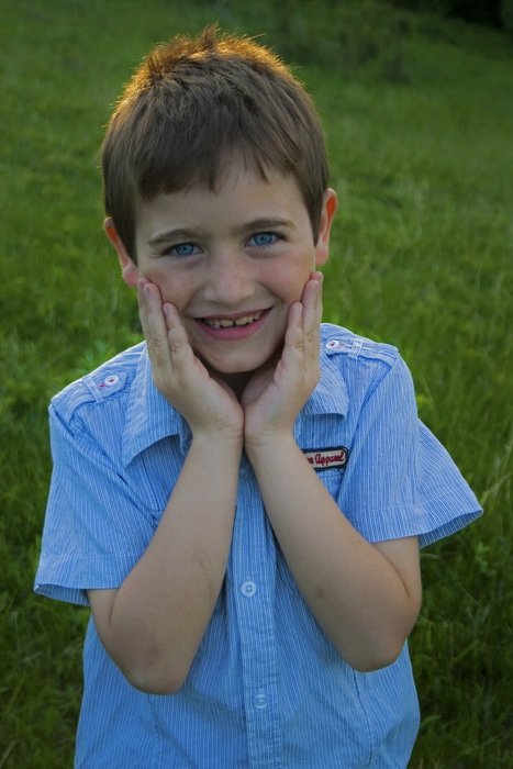 child boy in blue shirt outdoor