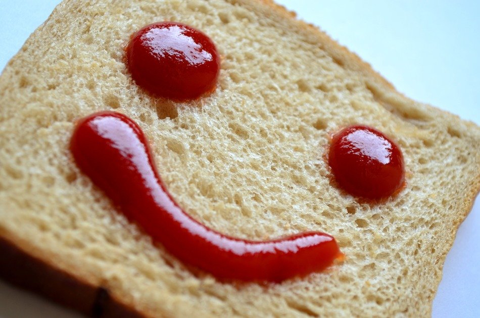 Smiley out of ketchup on bread