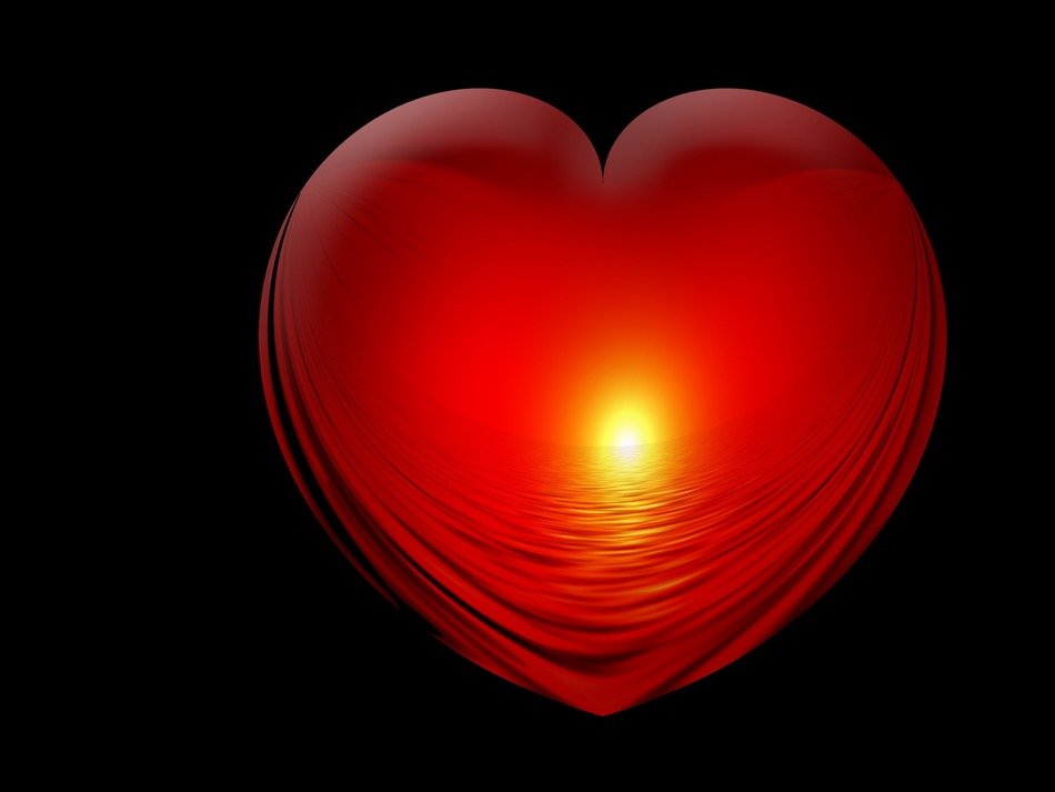red heart with the sun on a black background