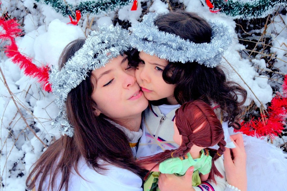portrait of mother with daughter in Christmas time
