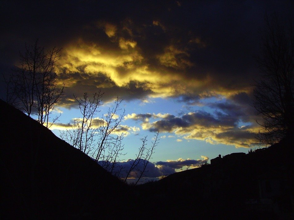 Beautiful view of sunset sky with dark clouds