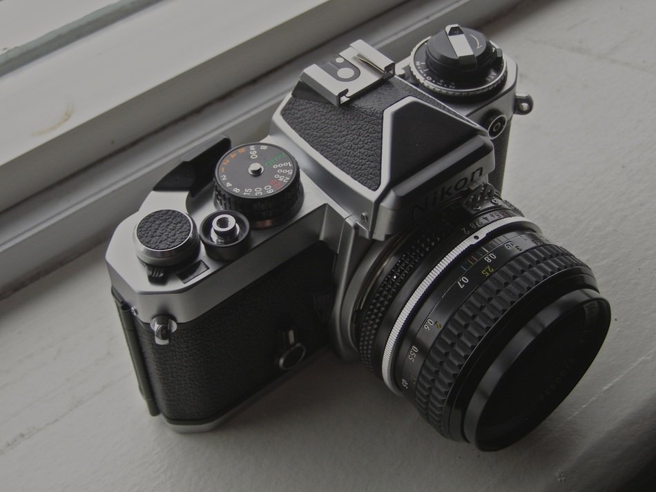 Nikon professional camera on the windowsill