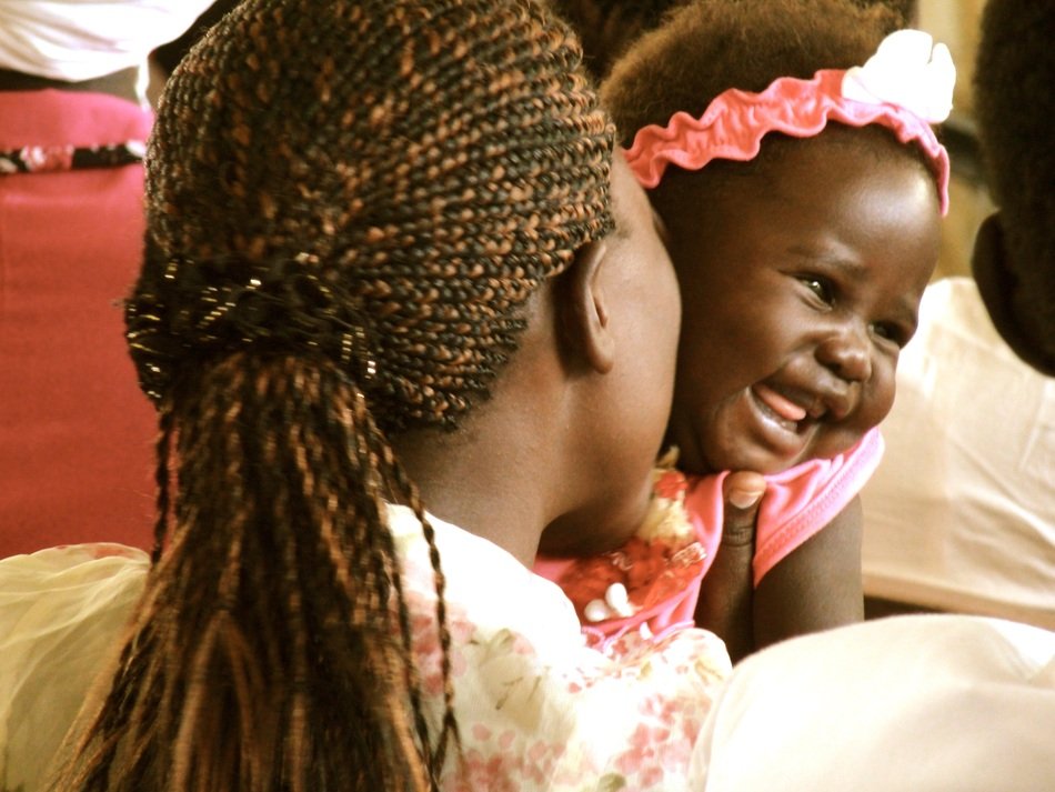baby africa and mom with pigtails