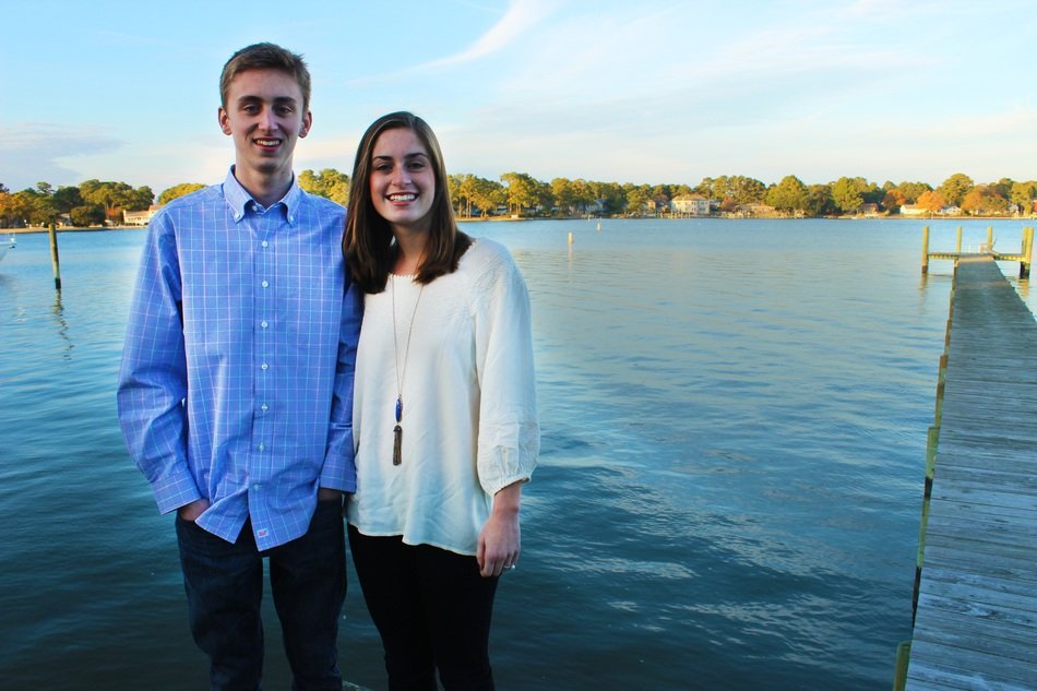 brother and sister posing at the pier