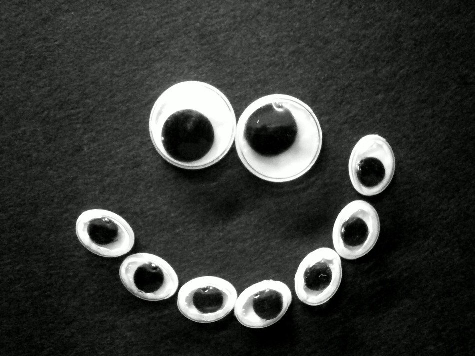 black and white wobbly eye smiley