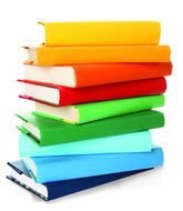 stack of multi-colored textbooks on a white background