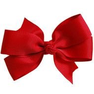 photo of a red bow on a white background
