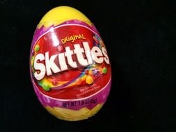 egg with Skittles candies