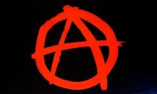 red anarchy sign on the black background